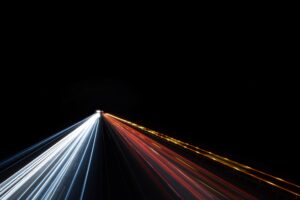 road with lights at night - logistic software development - multishoring