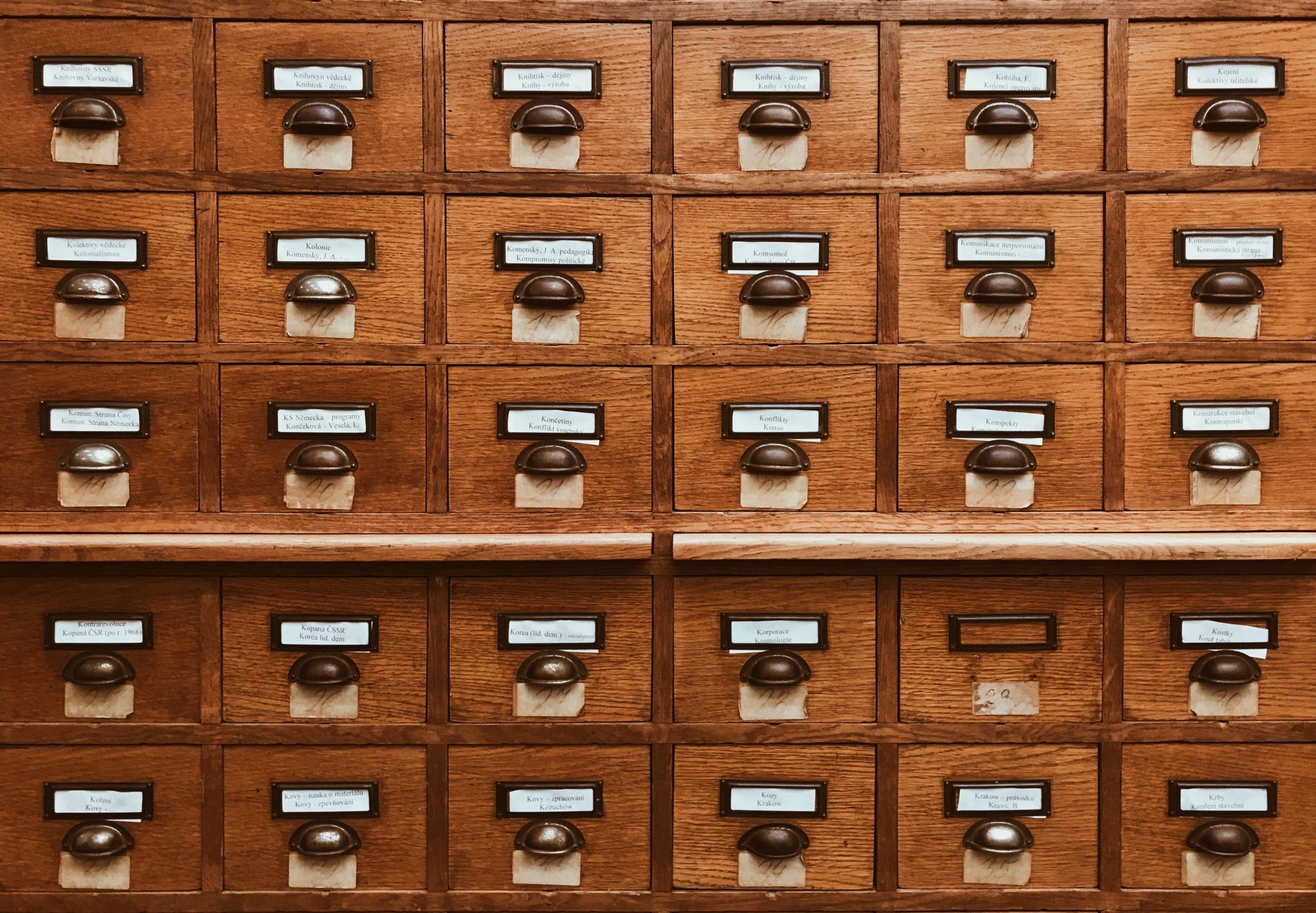 Brown wooden drawers - custom database development services - multishoring